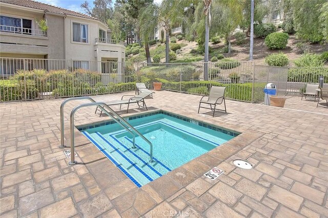 1995 Las Colinas Cir Unit 307, Corona, CA 92879 - view of pool featuring a pool, a patio, and a hot tub