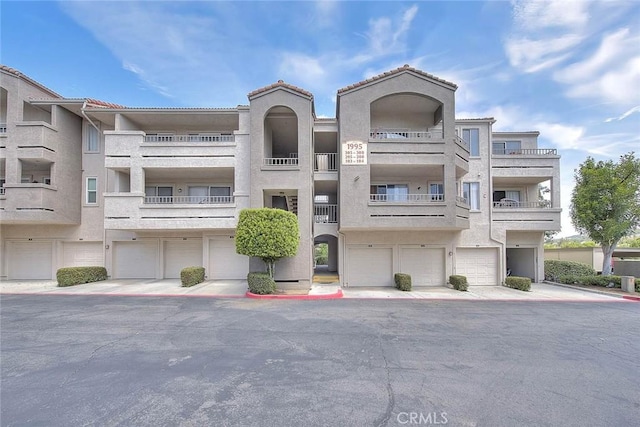 1995 Las Colinas Cir Unit 307, Corona, CA 92879 - view of apartment building / complex with a garage