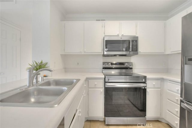 1995 Las Colinas Cir Unit 307, Corona, CA 92879 - kitchen featuring stainless steel appliances, a sink, white cabinetry, light countertops, and crown molding