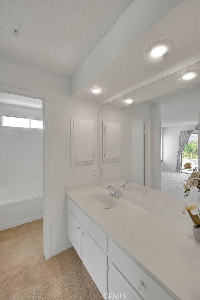 1995 Las Colinas Cir Unit 307, Corona, CA 92879 - full bathroom with vanity, recessed lighting, a textured ceiling, and tile patterned flooring