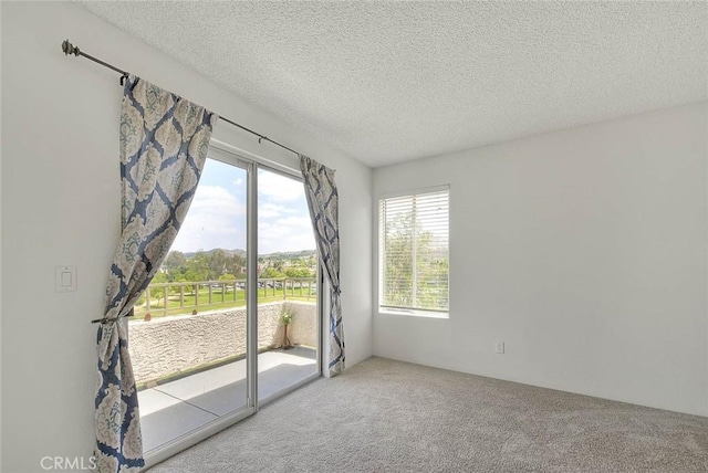 1995 Las Colinas Cir Unit 307, Corona, CA 92879 - carpeted empty room featuring a textured ceiling