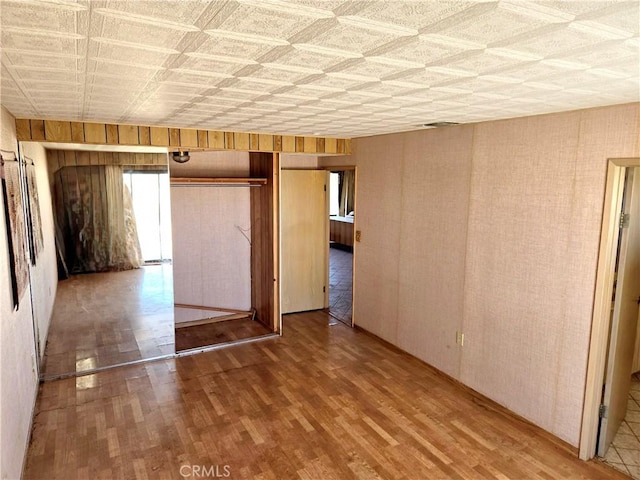 195 Old El Mirage Rd, Adelanto, CA 92301 - spare room featuring wood finished floors and wood walls