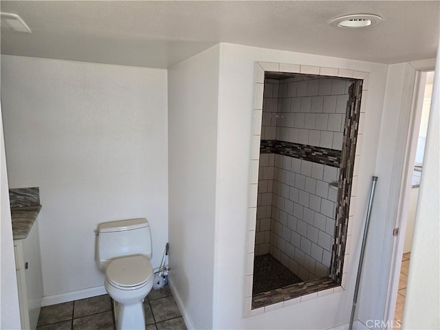 195 Old El Mirage Rd, Adelanto, CA 92301 - bathroom featuring a stall shower, toilet, baseboards, and tile patterned floors
