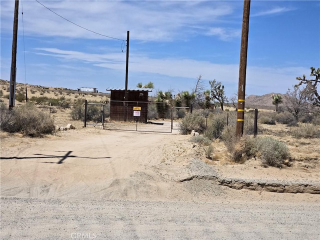 195 Old El Mirage Rd, Adelanto, CA 92301 - view of dirt / gravel road featuring a gate and a gated entry