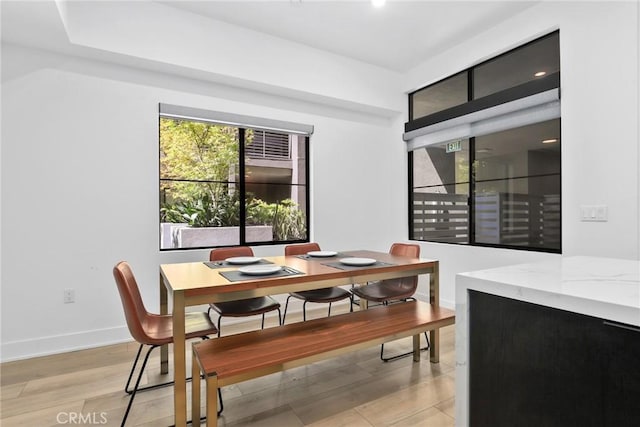 178 S Euclid Ave Unit 106, Pasadena, CA 91101 - dining area with baseboards and light wood-type flooring