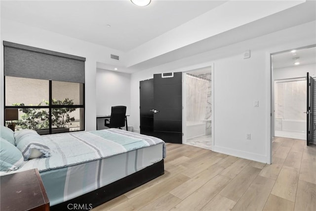 178 S Euclid Ave Unit 106, Pasadena, CA 91101 - bedroom featuring wood finished floors, baseboards, ensuite bathroom, and an office area