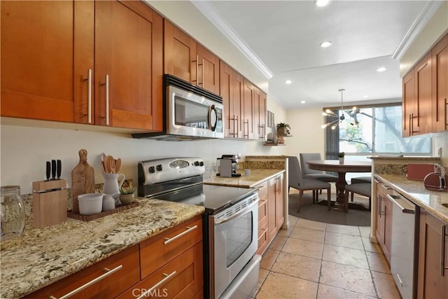 11970 Montana Ave Unit 102, Brentwood, CA 90049 - kitchen with stainless steel appliances, brown cabinets, recessed lighting, light stone counters, and ornamental molding