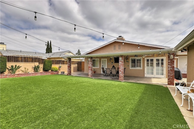 14522 San Feliciano Ln, Mirada, CA 90638 - rear view of property with a patio area and stucco siding