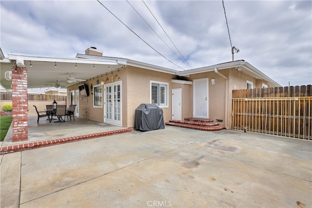 14522 San Feliciano Ln, Mirada, CA 90638 - back of house with a ceiling fan, stucco siding, a patio, french doors, and a chimney