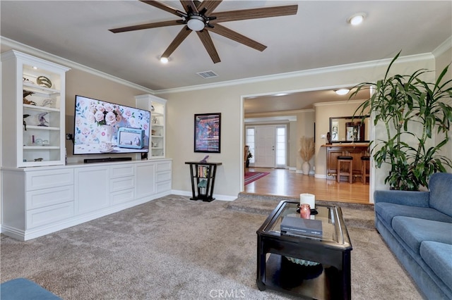 14522 San Feliciano Ln, Mirada, CA 90638 - carpeted living room with crown molding, a ceiling fan, baseboards, and built in features