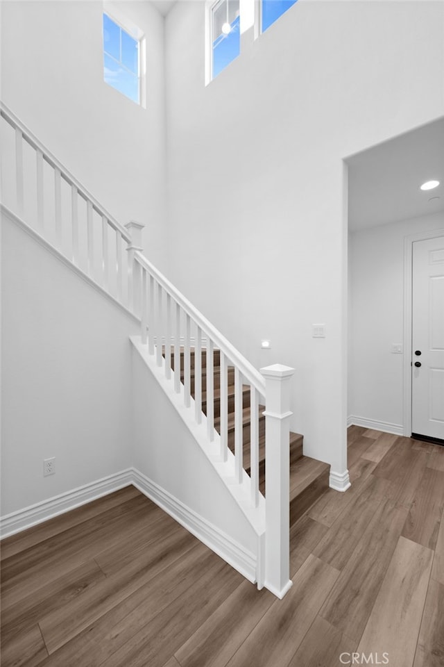 32129 Dymondia Way, Temecula, CA 92591 - stairway with wood finished floors, baseboards, and a towering ceiling