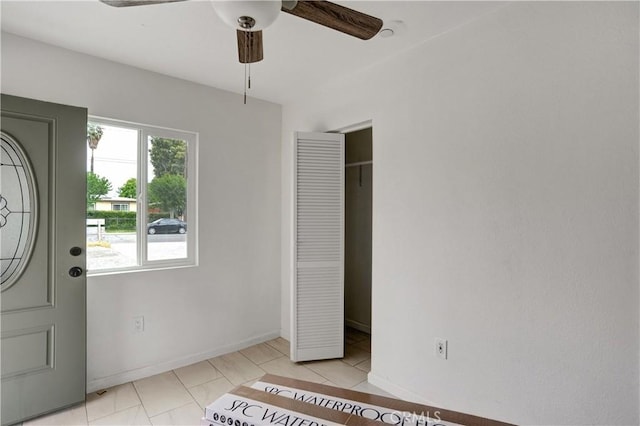 1467 W Olive St, San Bernardino, CA 92411 - foyer featuring ceiling fan, light tile patterned flooring, and baseboards