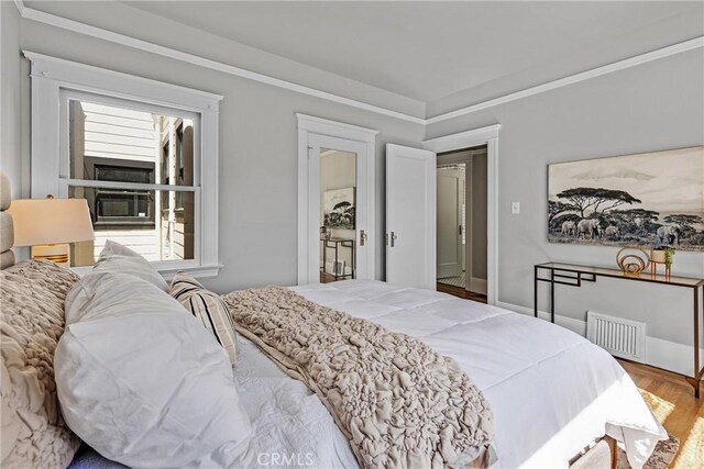 874 41st Ave, San Francisco, CA 94121 - bedroom featuring wood finished floors and crown molding
