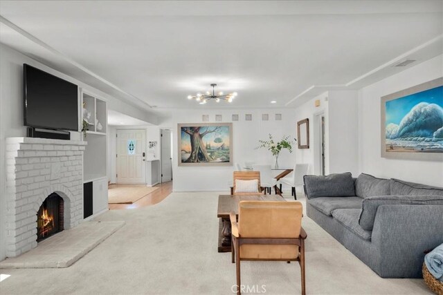 1801 Laurel Ave, Manhattan Beach, CA 90266 - living area with light carpet, a chandelier, and a brick fireplace