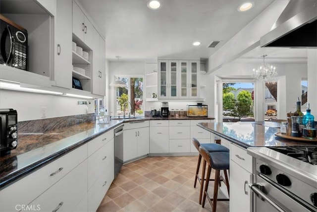 1801 Laurel Ave, Manhattan Beach, CA 90266 - kitchen with open shelves, wall chimney range hood, stainless steel appliances, a sink, and a chandelier