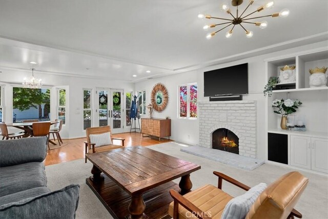 1801 Laurel Ave, Manhattan Beach, CA 90266 - living room with a chandelier, a brick fireplace, recessed lighting, and light wood finished floors