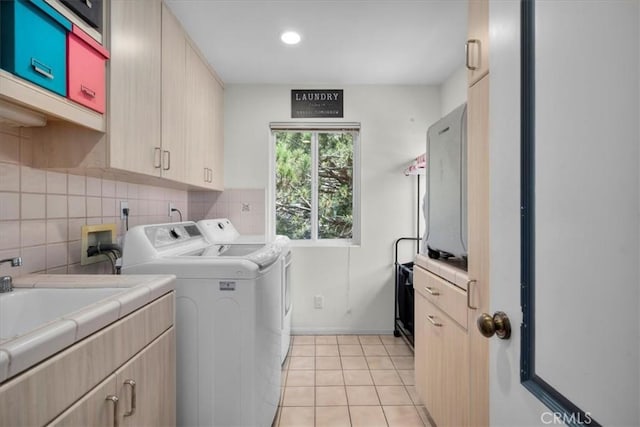 1801 Laurel Ave, Manhattan Beach, CA 90266 - laundry room with washer and clothes dryer, cabinet space, light tile patterned floors, baseboards, and recessed lighting