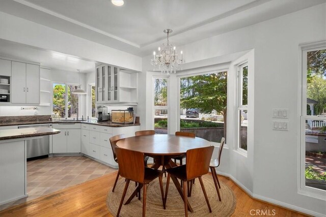 1801 Laurel Ave, Manhattan Beach, CA 90266 - dining space featuring a chandelier, healthy amount of natural light, and light wood-style floors