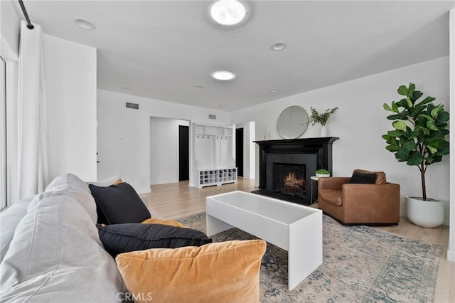 14332 Roblar Pl, Sherman Oaks, CA 91423 - living area featuring wood finished floors and a lit fireplace