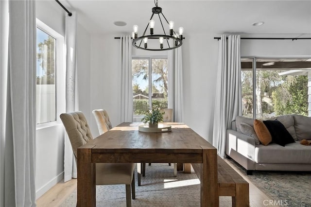 14332 Roblar Pl, Sherman Oaks, CA 91423 - dining room with a chandelier and light wood-type flooring