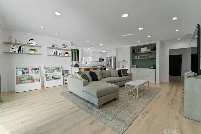 14332 Roblar Pl, Sherman Oaks, CA 91423 - living room with light wood-type flooring, recessed lighting, baseboards, and washer / dryer