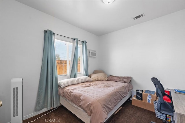 21620 Garibaldi Ct, California City, CA 93505 - bedroom with carpet floors and a wall mounted AC