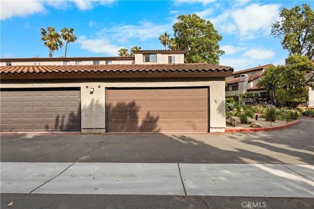 1188 Via Montoya, Camarillo, CA 93010 - view of front of house with stucco siding and community garages
