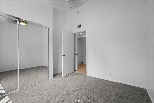 1188 Via Montoya, Camarillo, CA 93010 - unfurnished bedroom with light carpet, a closet, baseboards, a high ceiling, and ceiling fan