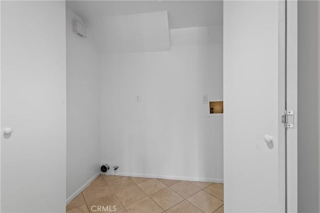 1188 Via Montoya, Camarillo, CA 93010 - laundry area with hookup for a washing machine, light tile patterned floors, and baseboards