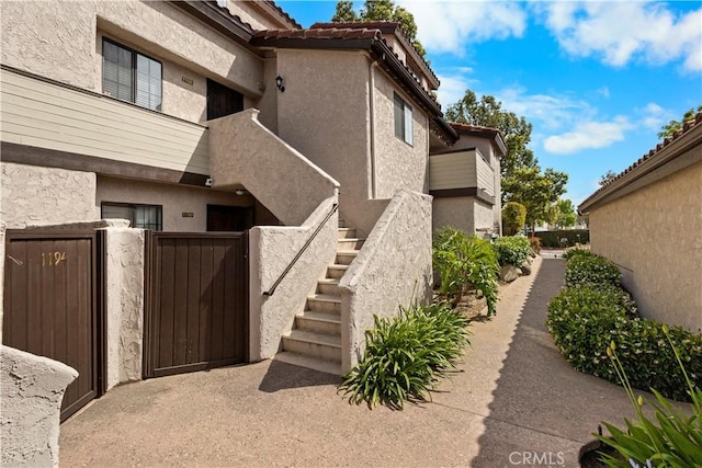 1188 Via Montoya, Camarillo, CA 93010 - view of home's exterior with a gate, stucco siding, and stairs