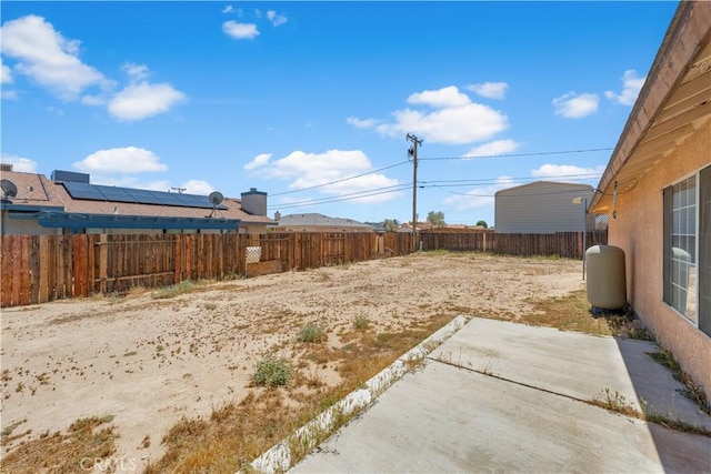 9824 Evelyn Ave, California City, CA 93505 - fenced backyard with a patio area