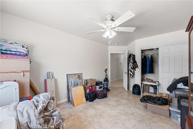 9824 Evelyn Ave, California City, CA 93505 - bedroom with a closet, ceiling fan, light tile patterned flooring, and baseboards
