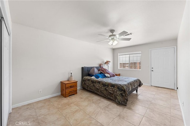 9824 Evelyn Ave, California City, CA 93505 - bedroom with ceiling fan, baseboards, and light tile patterned floors