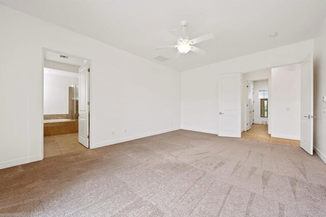 74158 Pele Pl, Palm Desert, CA 92211 - tiled spare room featuring carpet floors, a ceiling fan, and baseboards