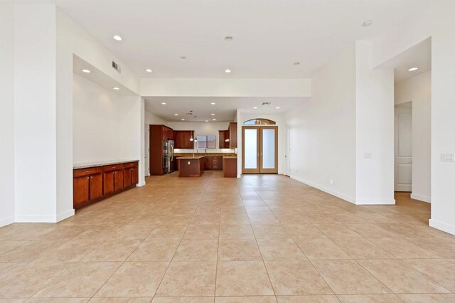 74158 Pele Pl, Palm Desert, CA 92211 - unfurnished living room with light tile patterned flooring, recessed lighting, and baseboards
