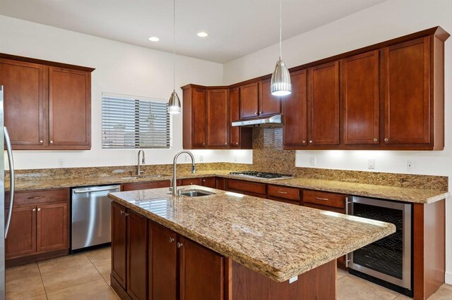 74158 Pele Pl, Palm Desert, CA 92211 - kitchen with beverage cooler, stainless steel appliances, under cabinet range hood, a sink, and light stone counters
