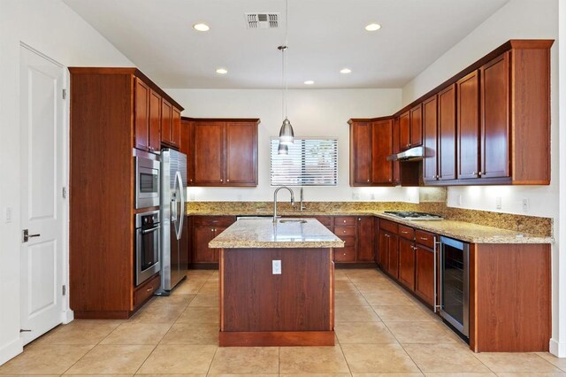 74158 Pele Pl, Palm Desert, CA 92211 - kitchen with wine cooler, stainless steel appliances, a sink, light stone countertops, and a kitchen island with sink