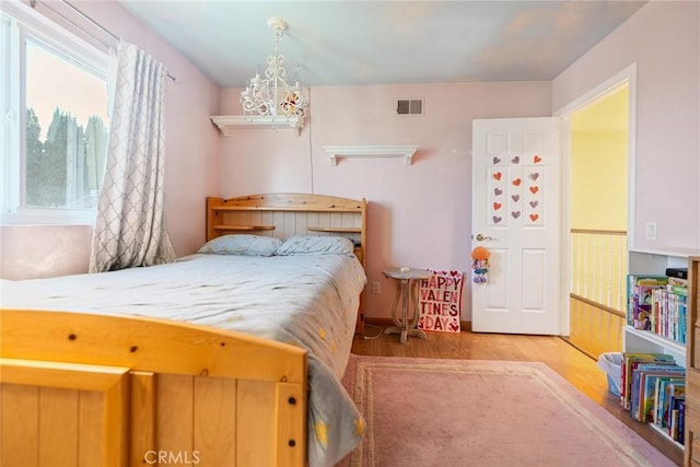 2445 N Santiago Blvd, Orange, CA 92867 - bedroom featuring wood finished floors and a chandelier