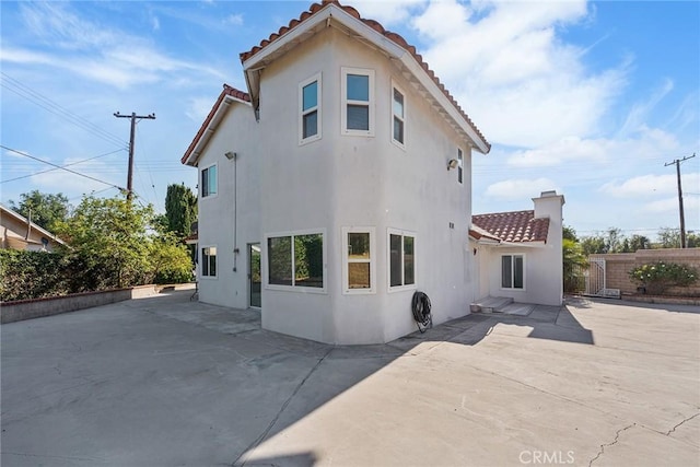 2445 N Santiago Blvd, Orange, CA 92867 - rear view of property with a tiled roof, stucco siding, and a patio area