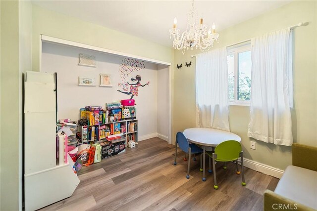 2445 N Santiago Blvd, Orange, CA 92867 - game room featuring a chandelier and wood finished floors