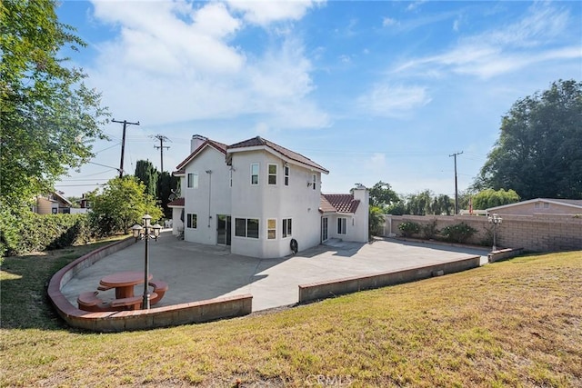 2445 N Santiago Blvd, Orange, CA 92867 - back of property with a patio, stucco siding, and a fenced backyard