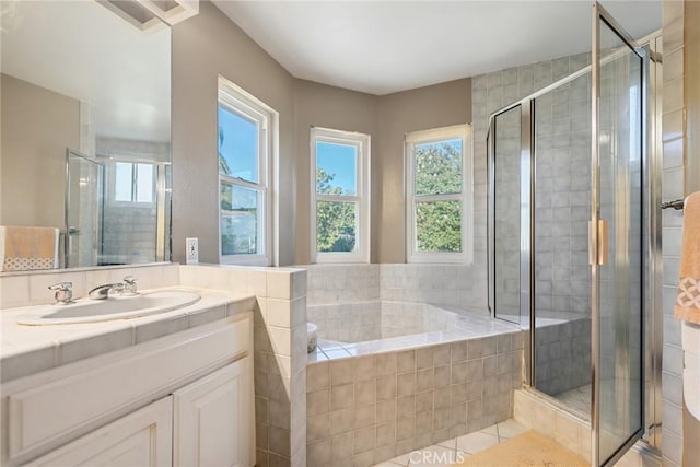 2445 N Santiago Blvd, Orange, CA 92867 - bathroom featuring vanity, a garden tub, a shower stall, and tile patterned floors