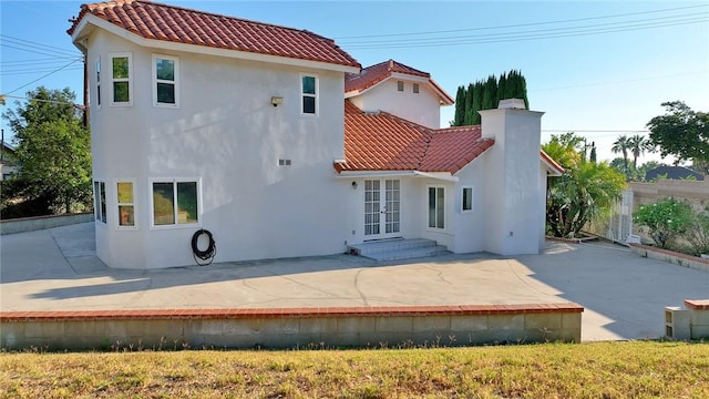 2445 N Santiago Blvd, Orange, CA 92867 - back of property with a tile roof, a patio area, and stucco siding