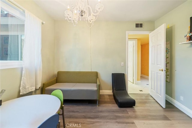 2445 N Santiago Blvd, Orange, CA 92867 - living area featuring a chandelier and wood finished floors