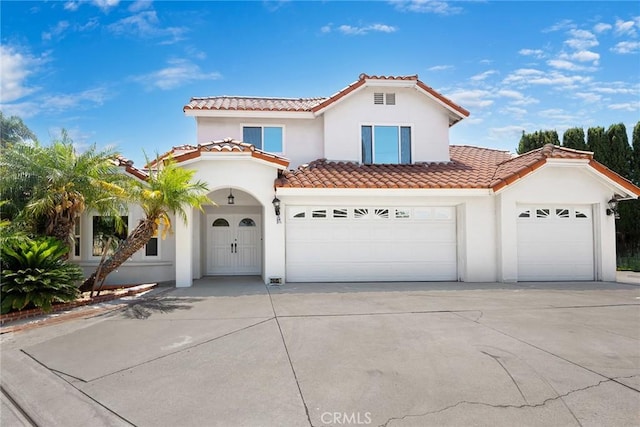 2445 N Santiago Blvd, Orange, CA 92867 - mediterranean / spanish house with stucco siding, a tiled roof, driveway, and an attached garage