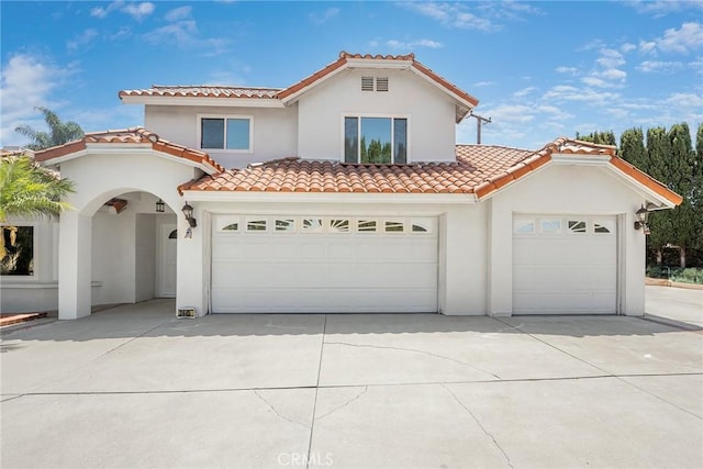 2445 N Santiago Blvd, Orange, CA 92867 - mediterranean / spanish home with concrete driveway, stucco siding, and a tiled roof