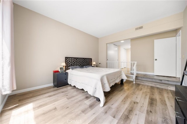 11 Palos Unit 55, Irvine, CA 92612 - bedroom featuring light wood-style flooring and baseboards