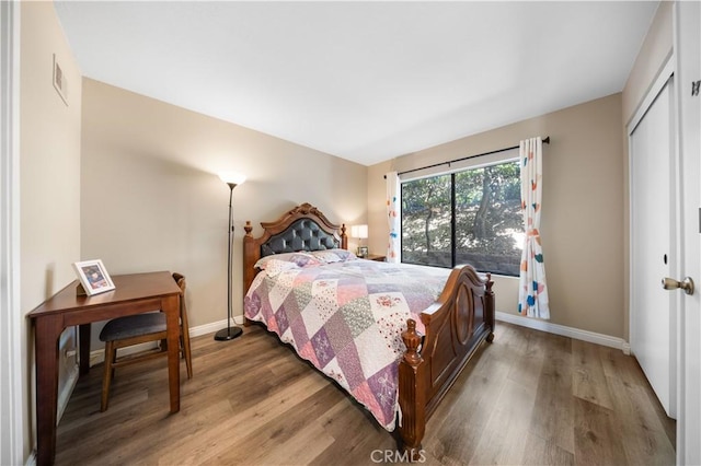 11 Palos Unit 55, Irvine, CA 92612 - bedroom featuring wood finished floors, baseboards, and a closet