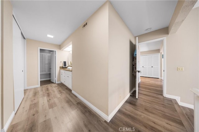 11 Palos Unit 55, Irvine, CA 92612 - corridor featuring light wood-style floors and baseboards