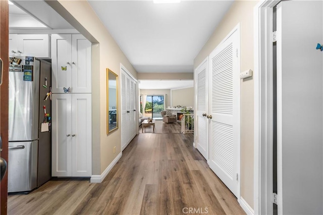 11 Palos Unit 55, Irvine, CA 92612 - hallway with wood finished floors and baseboards